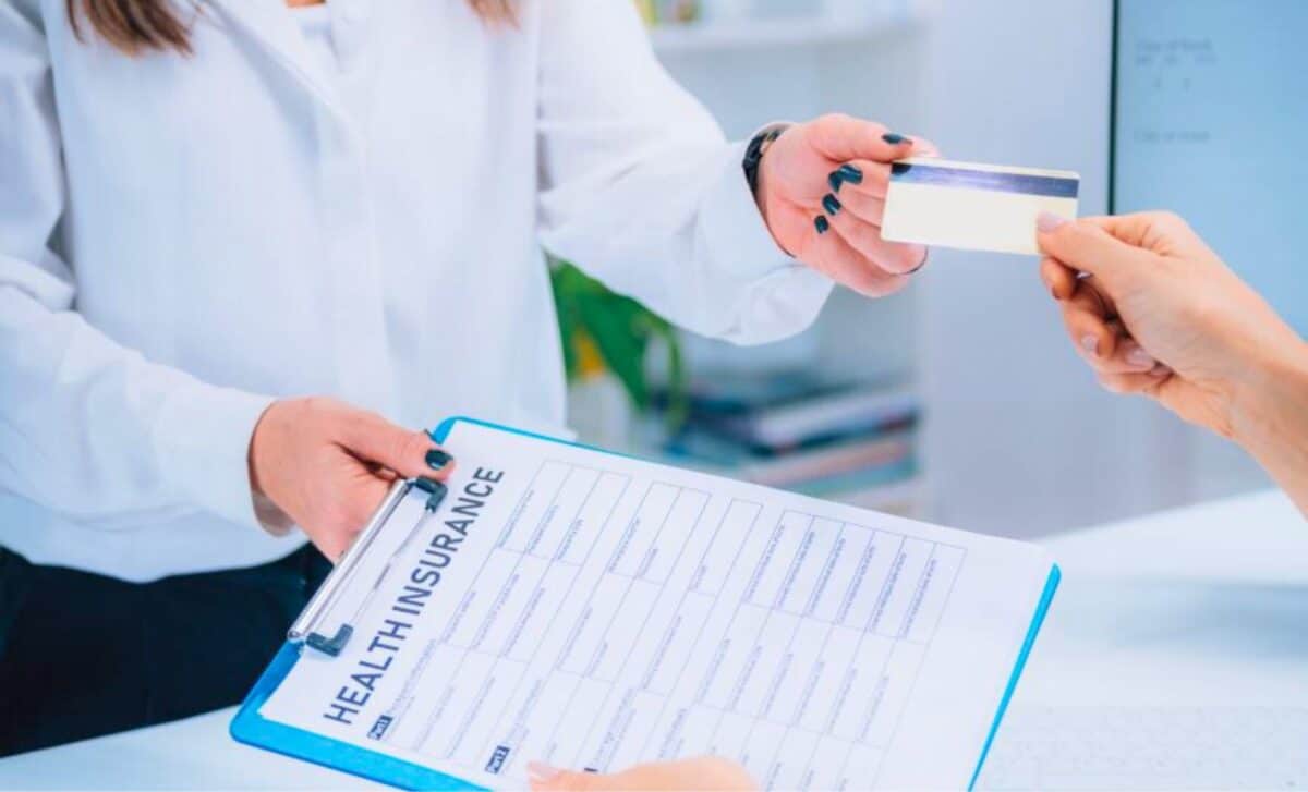 Woman Paying Health Insurance with Credit Card