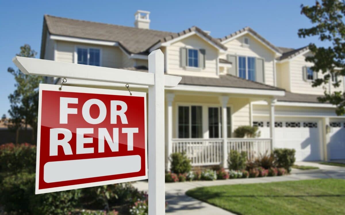 ATO For Rent Real Estate Sign in Front of House