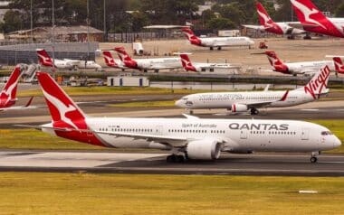 A Qantas Boeing 787 taxiing at an airport