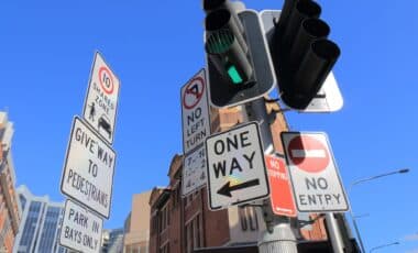 An Intersection with Multiple Clear Signs including "One Way", "No Entry", "No Left Turn" Credit: tktktk - stock.adobe.com