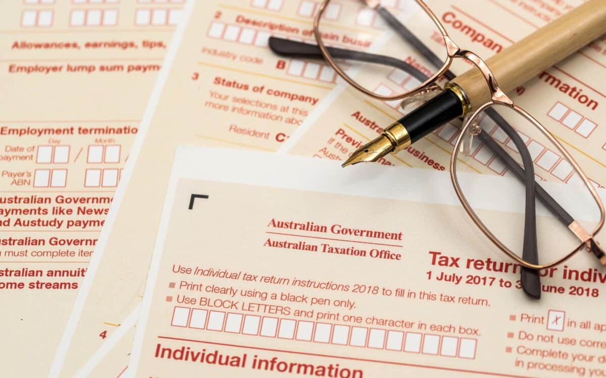 Australian tax declaration and pen on wooden table