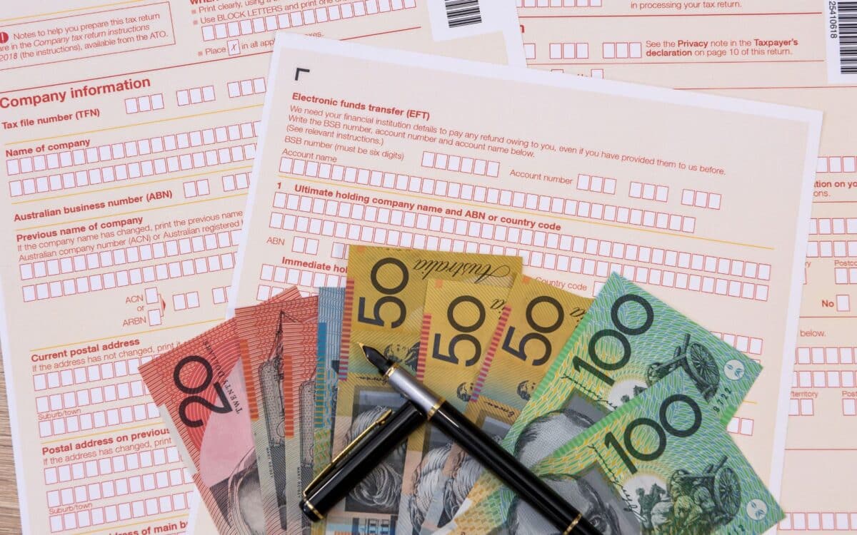 Australian Tax Form with Pen and Australian Dollars on It. Taxation Company