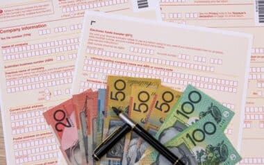 Australian Tax Form with Pen and Australian Dollars on It. Taxation Company