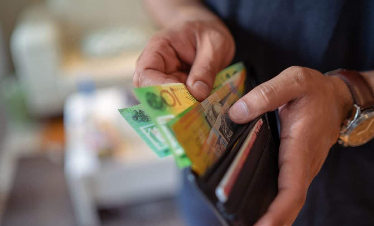 Man Taking Money out of Wallet
