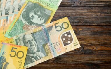 wooden background + Australian Dollar Banknotes