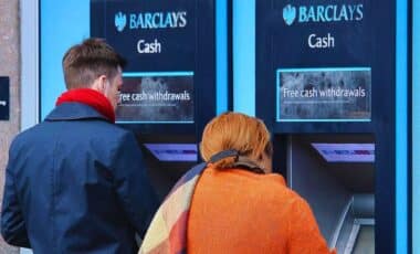 Two Individuals Withdrawing Money From Barclays