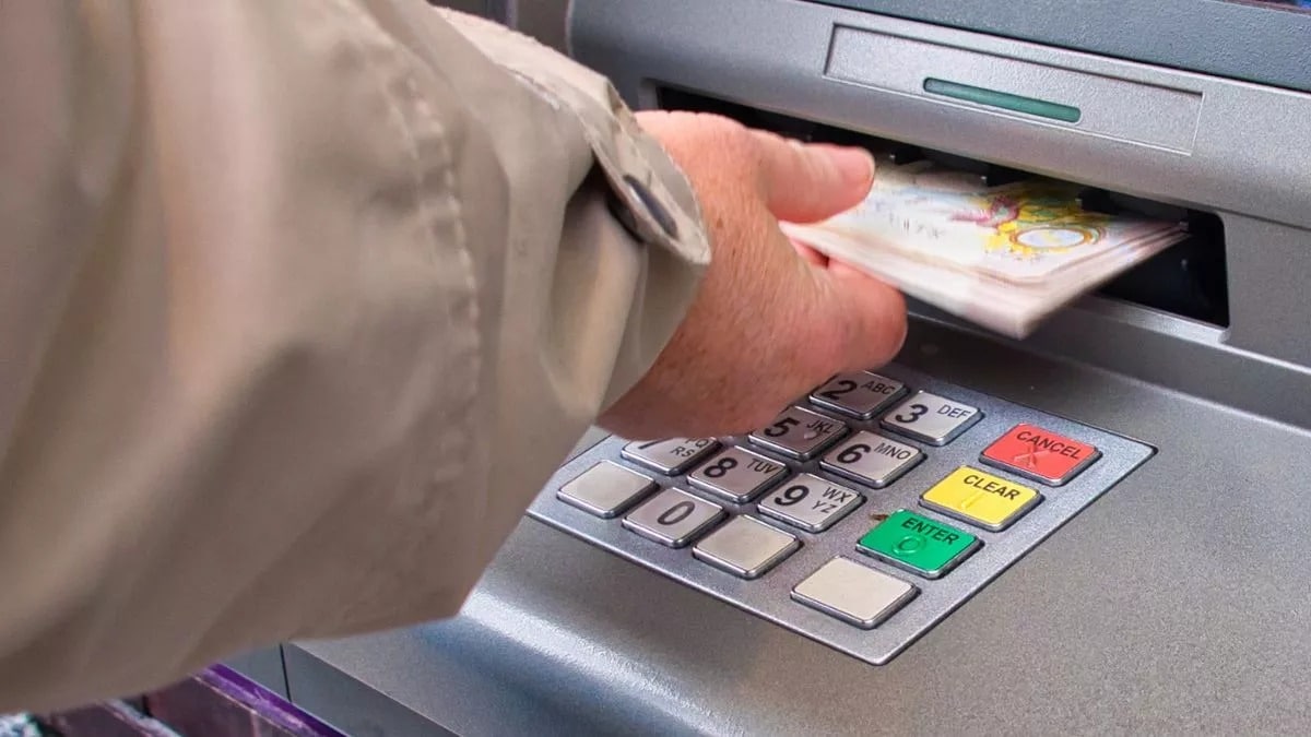 Bank hand withdrawing money