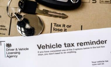 Car Tax Reminder from the DVLA Emphasizing Tax it or Lose it with a Set of Keys in the Background