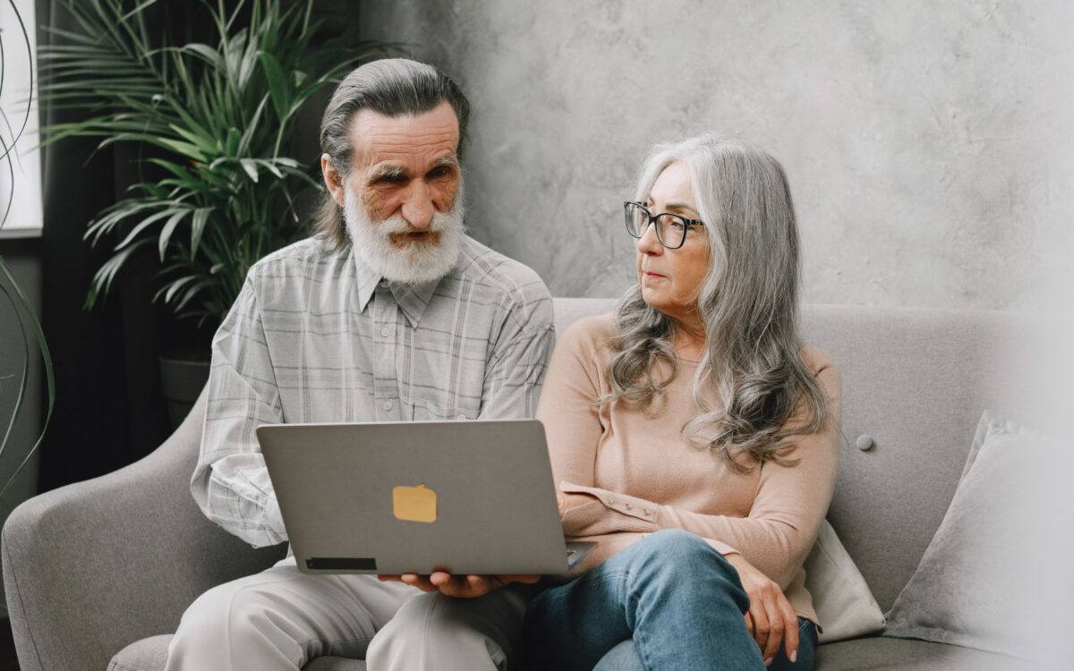 Elderly Couple sitting at a Sofa, reviewing 5 key changes to state pensions