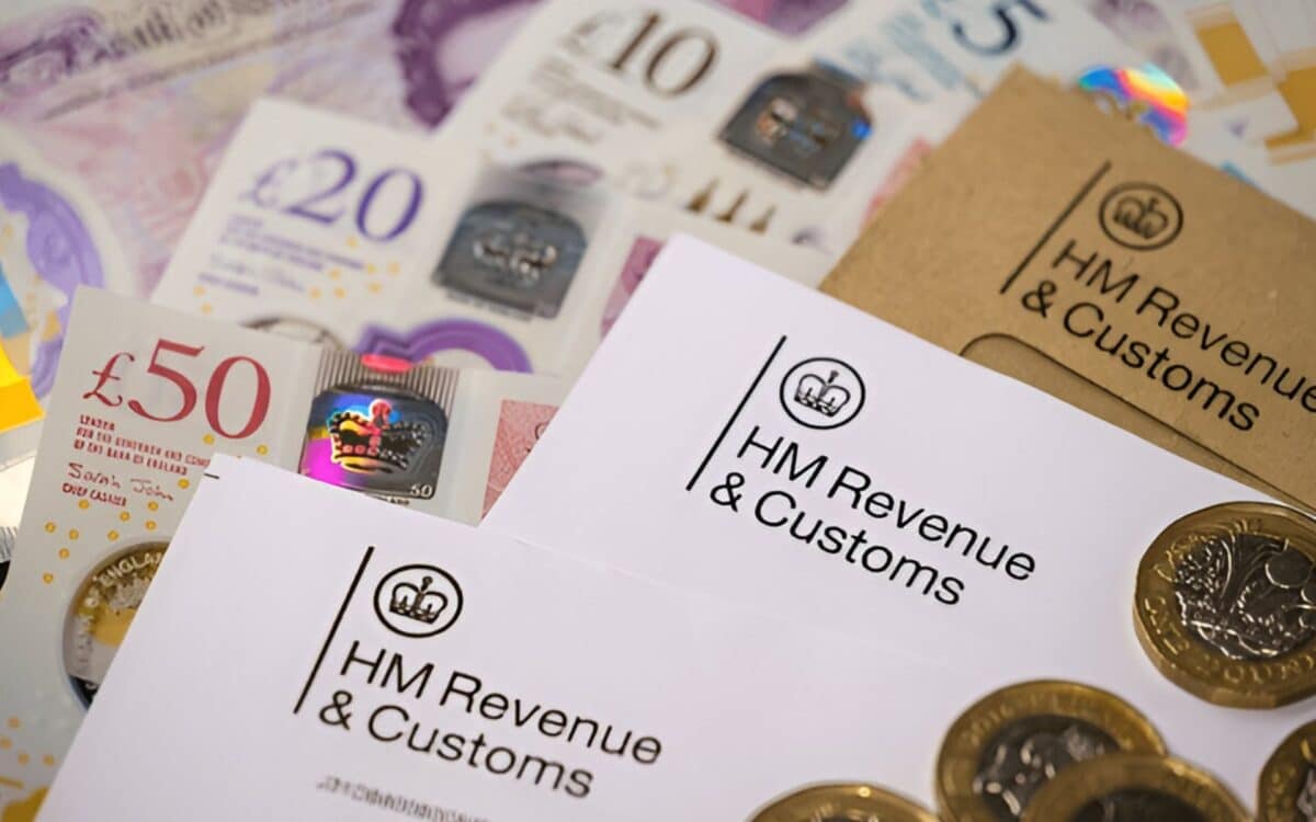 HM Revenue & Customs (HMRC) placed alongside various denominations of British currency, including £10, £20, and £50 notes