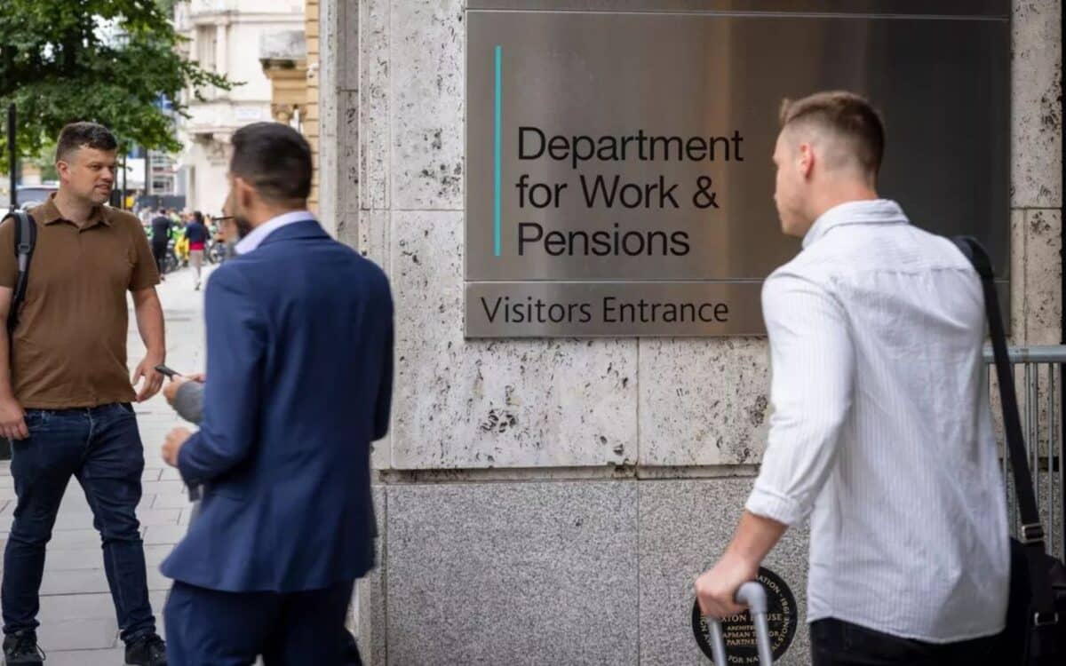 The entrance to the Department for Work & Pensions (DWP), with a clear metallic sign reading Department for Work & Pensions