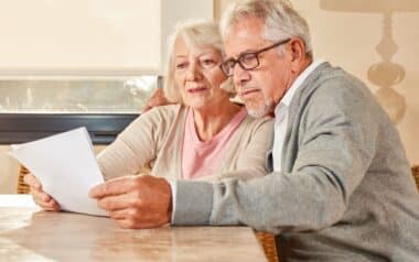 Senior Couple Reading Triple Lock Pension