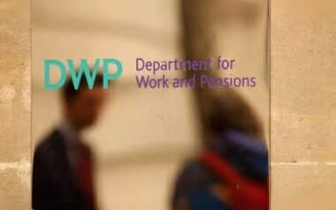 the Department for Work and Pensions (DWP) displayed on a reflective surface
