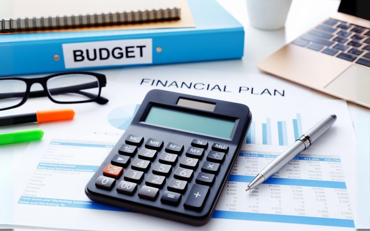 A desk with various financial items