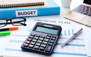 A desk with various financial items