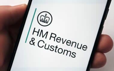 a smartphone screen displaying the official HM Revenue & Customs (HMRC) logo