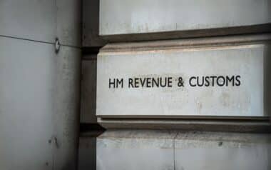 stone wall with bold black letters reading HM Revenue & Customs ( HMRC )