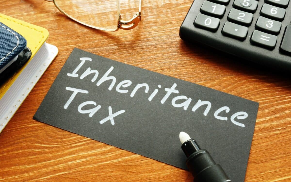 Desk setup with Inheritance Tax written on card