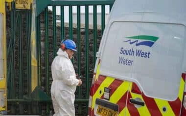 A South West Water engineer works near a service vehicle