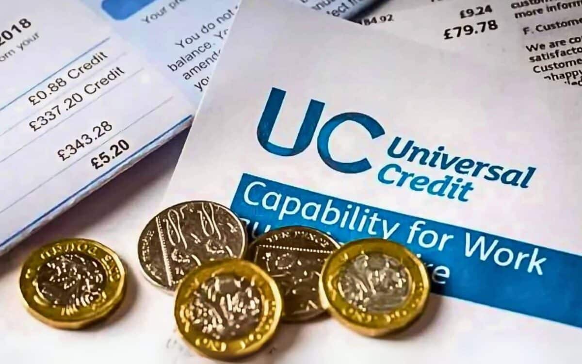 Universal Credit statement with several pound coins