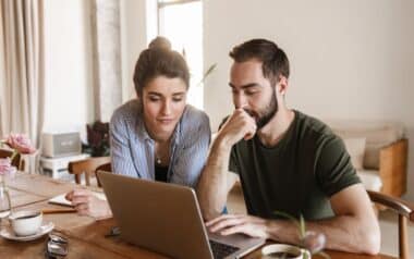 Couple Working on Laptop Together