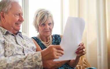 Elderly couple reading a letter about their State Pension