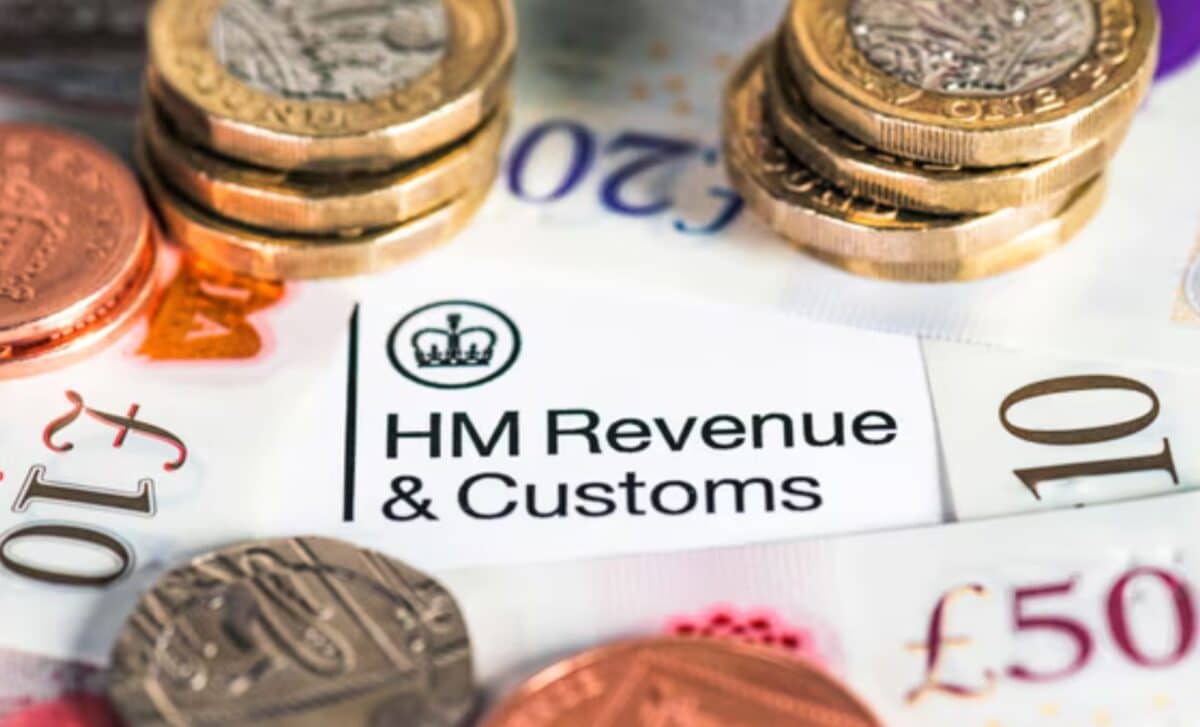 HMRC Paper Surrounded by Coins and UK Bank Notes Image Credit: George Clerk/Getty Images/iStockphoto