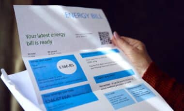 Hand Holding UK Energy Bill