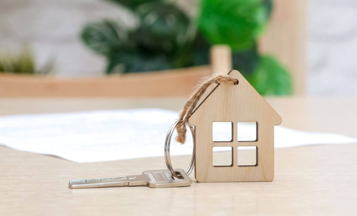 House key with small keyring resembeling wooden house