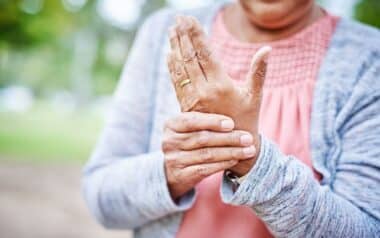 Senior Woman with Wrinkled Hands and got arthritis