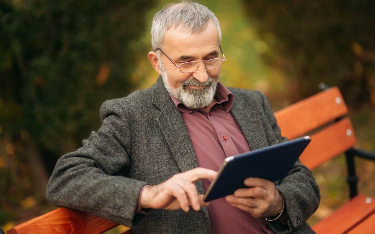 Grandpa Using Tablet in the Park