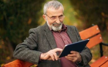 Grandpa Using Tablet in the Park
