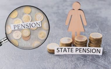 A wooden female figure stands beside stacks of coins labelled "State Pension," with a magnifying glass highlighting the word "Pension" over scattered euros.