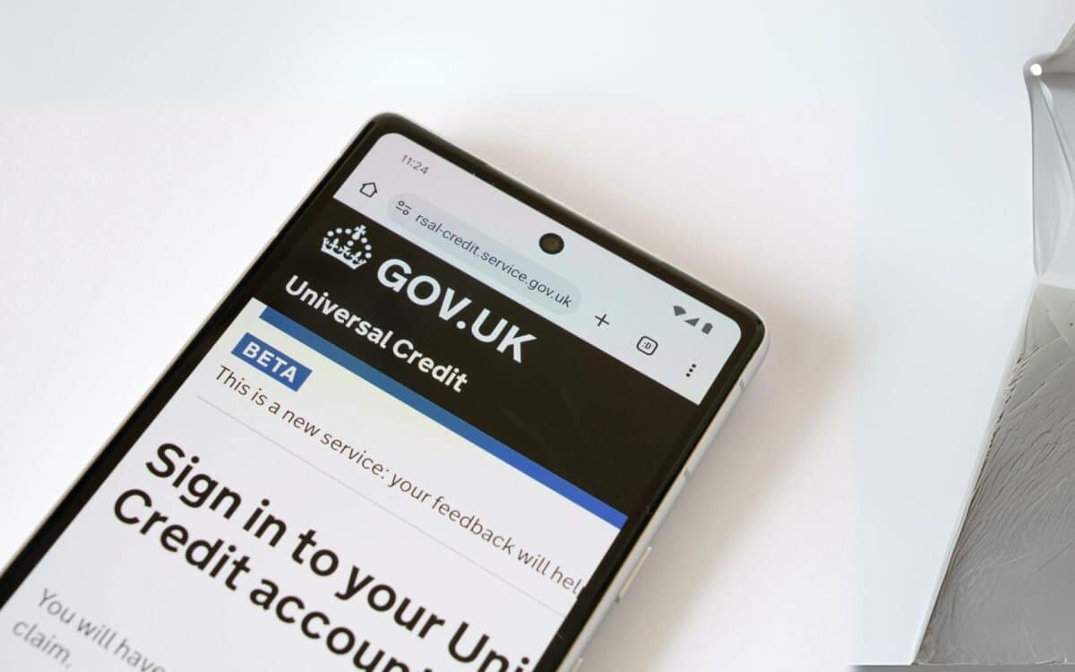 a smartphone displaying the Universal Credit sign-in page on the official UK government website (GOV.UK)