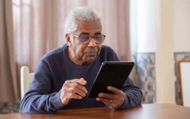 An Elderly Ma Using a Digital Tablet