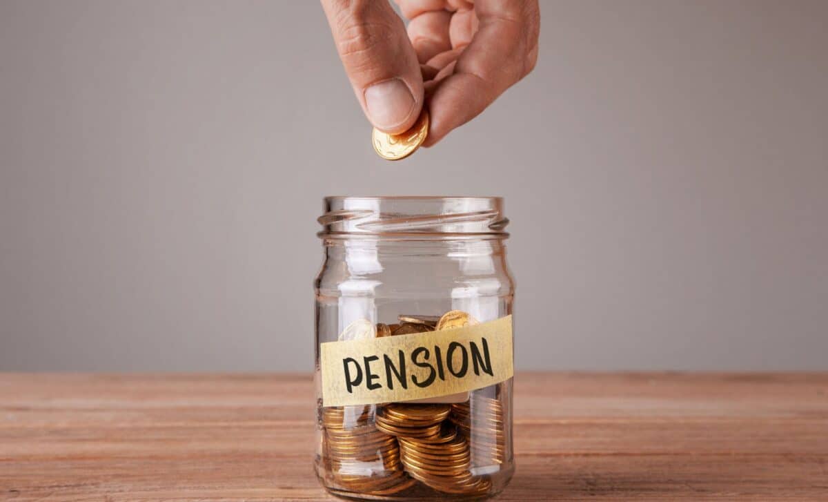 Pension. Glass jar with coins and an inscription pension