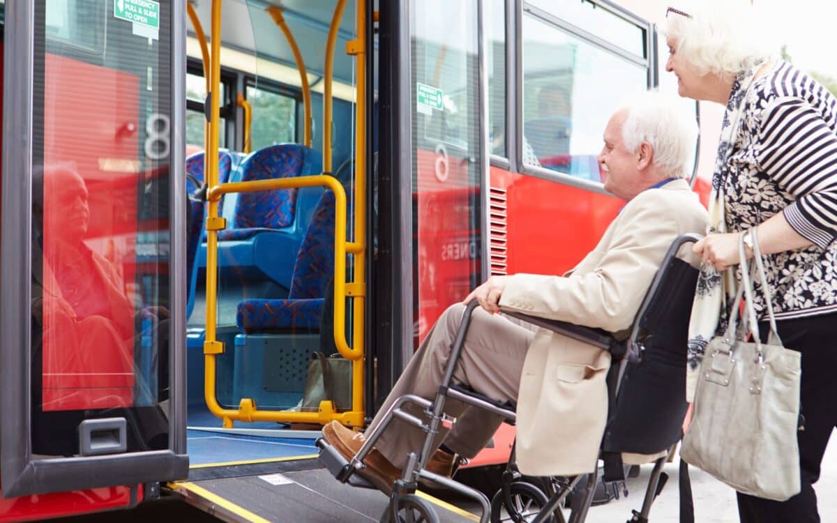 Senior Couple Boarding Bus