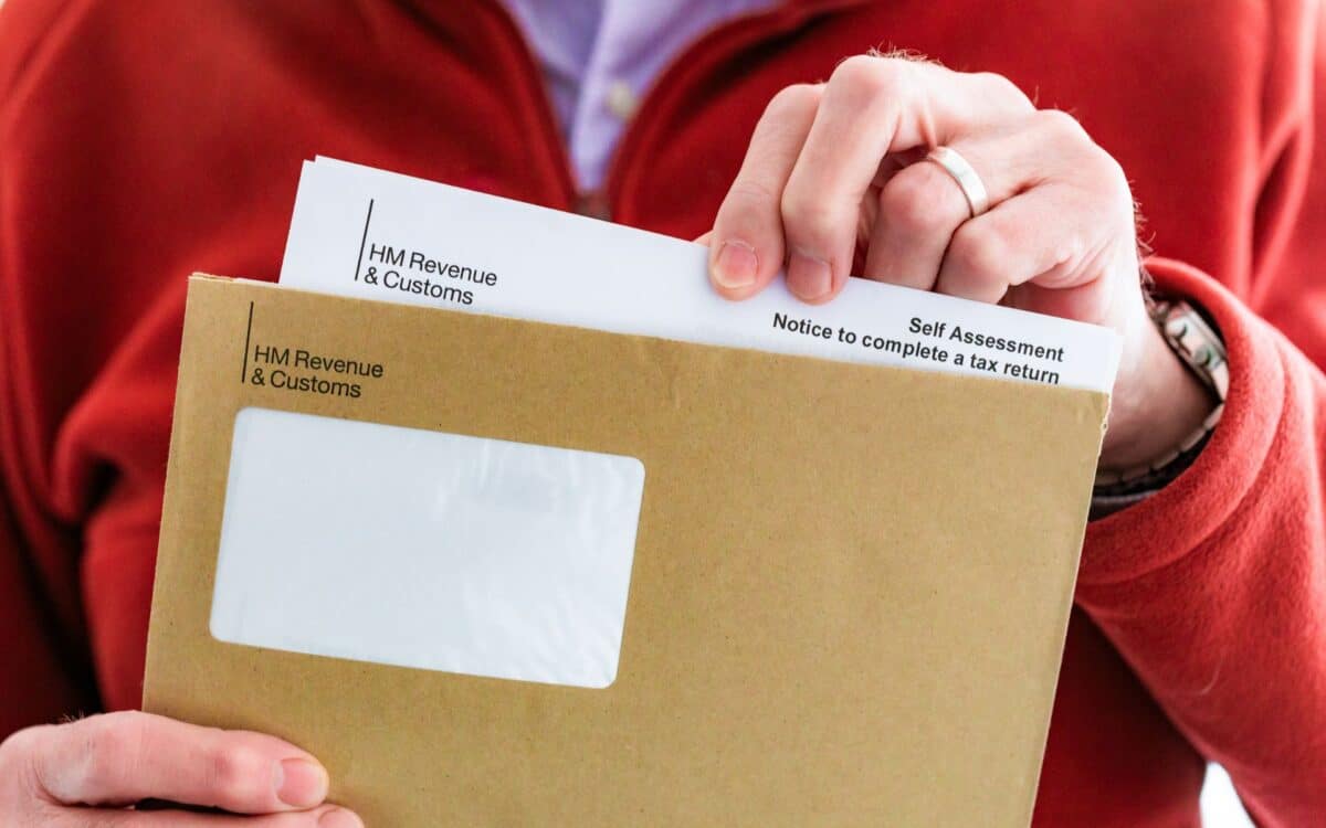 Senior man opening HMRC tax letter