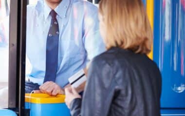 Woman Boarding Free Bus Pass. Credit: Canva
