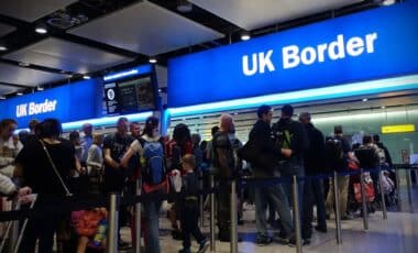 Air travellers are queuing at the entrance doors of passport control at Heathrow Airport on 24th August 2018 in London, UK. The UK’s aviation hub is the busiest in the world for international passenger traffic.