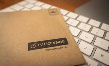 TV Licence envelope against a computer keyboard.