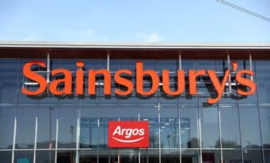 A Sainsbury's supermarket storefront featuring an Argos sign above the entrance