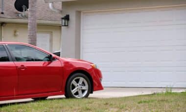 Red car in a driveway