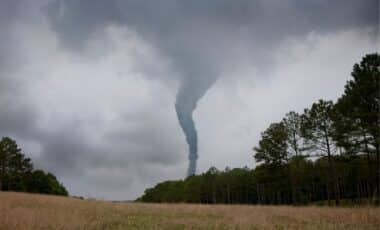 A Tornado Forming In Rainy Background Weather