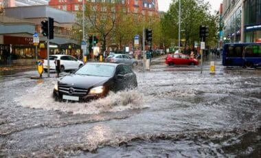 A Car On A Flooded Streedt During A Rainy Weather