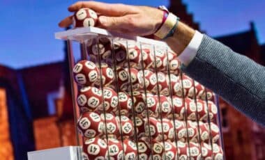 A Man Filling The Lottery Machine With The Balls For The Rehearsal For The Draws Of The Euromillions Lottery