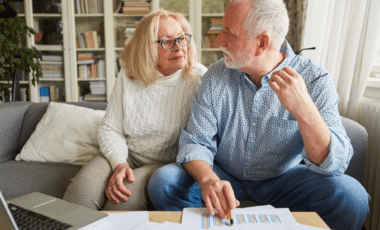 Couple Of Retirees Discussing Retirement Plan