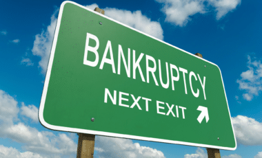 "Bankruptcy Next Exit" written on Green Road Panel