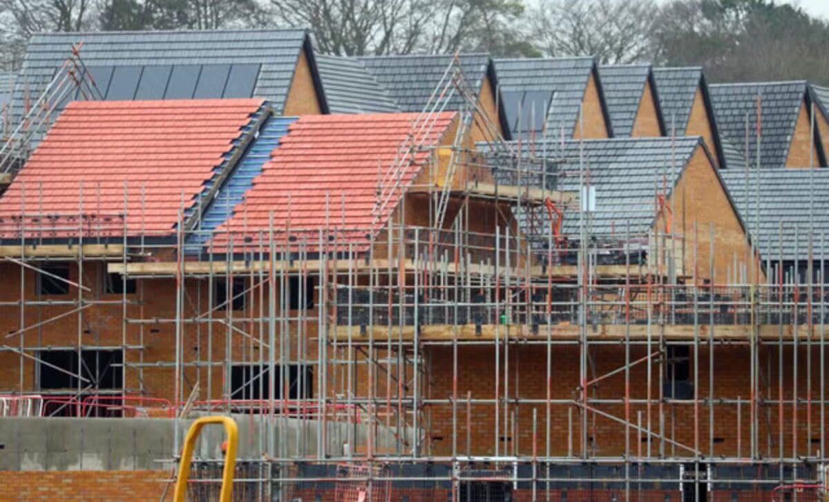 UK Housebuilders : House Under Construction With Scaffolding Around It