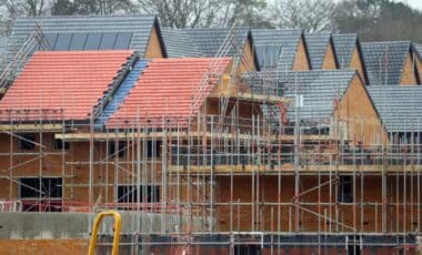 UK Housebuilders : House Under Construction With Scaffolding Around It